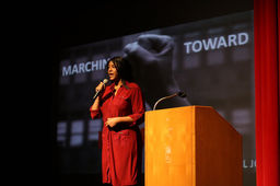 Janée Woods Weber speaking at assembly