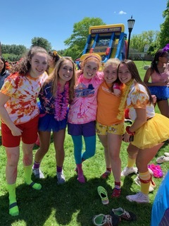 students dress in sun and dial colors