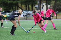 two players during a field hockey game