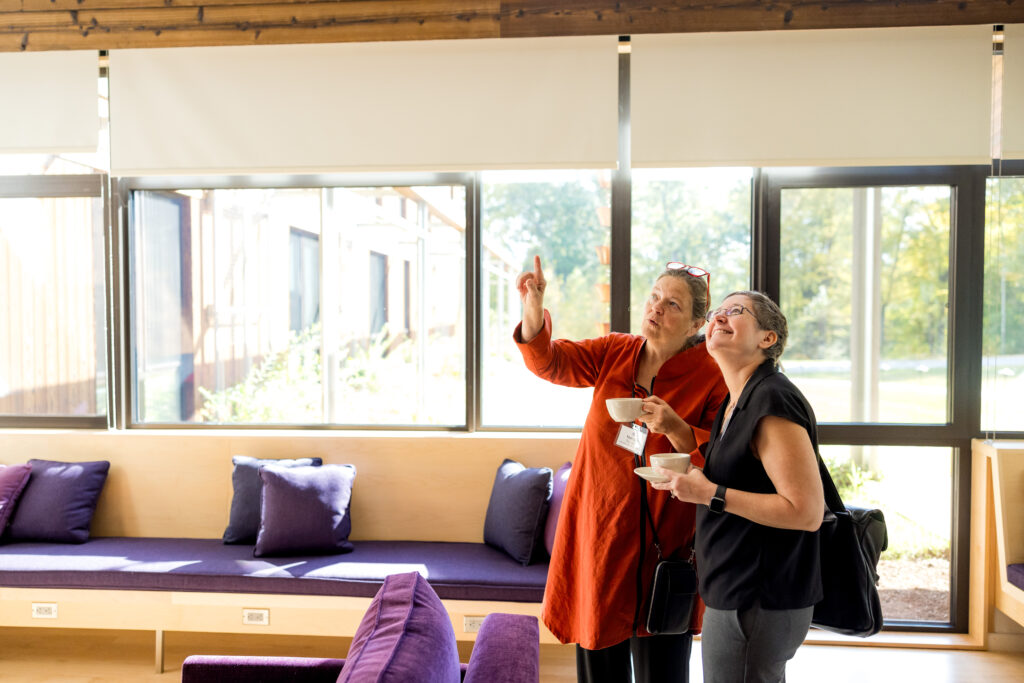 Alumnae Board members of The Ethel Walker School stand in admiration of the new sustainable dorm